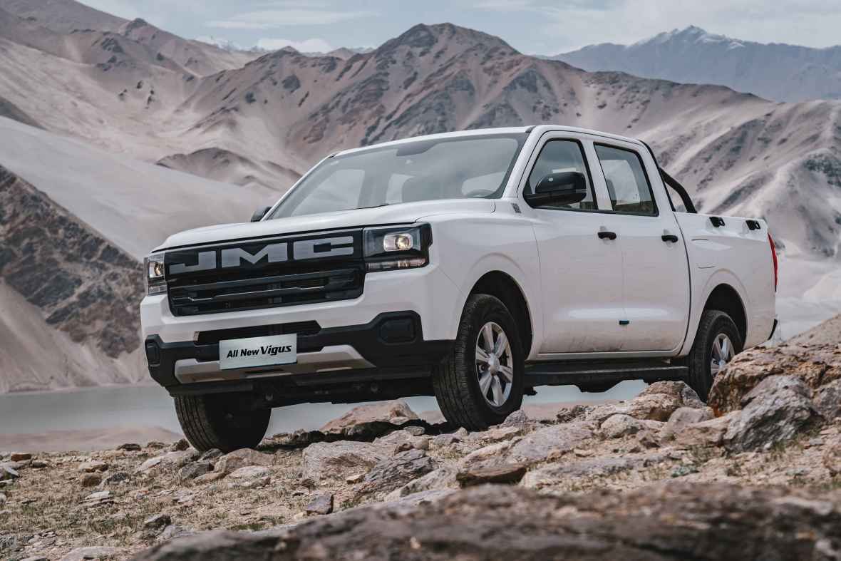 JMC All New Vigus double cab pickup in white on rocky mountain terrain